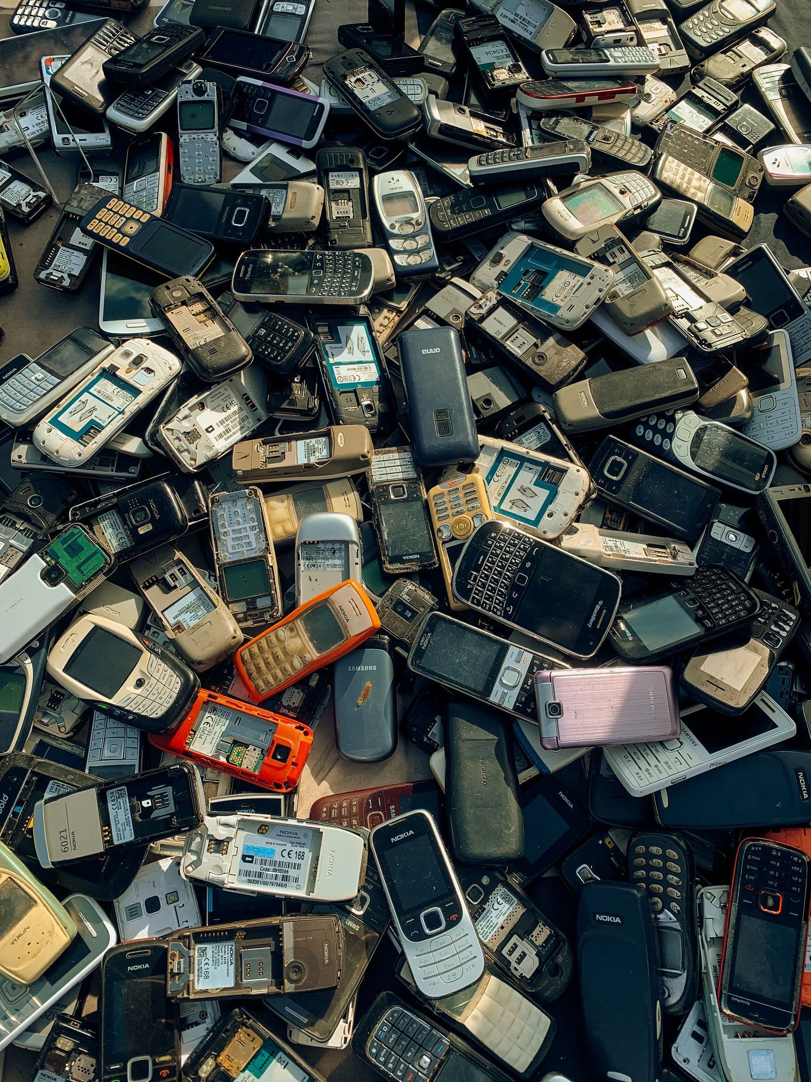 Stockpiled mobile phone e-waste awaiting processing